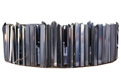 Lot 477 - A contemporary mirrored finish blackened metal...
