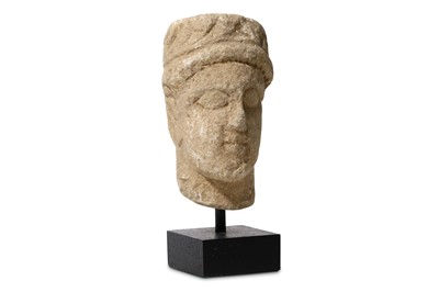 Lot 68 - A CYPRIOT LIMESTONE HEAD Circa 6th - 5th...