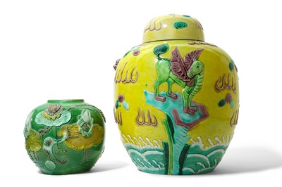 Lot 513 - TWO CHINESE SANCAI-GLAZED BISCUIT JARS AND A...