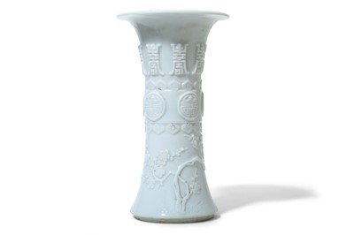 Lot 76 - A CHINESE MOULDED WHITE-GLAZED VASE, GU. Qing...
