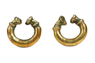 Lot 80 - A PAIR OF WESTERN ASIATIC GOLD ON BRONZE...