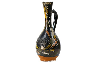 Lot 175 - A BLACK-GLAZED POLYCHROME-PAINTED CANAKKALE...
