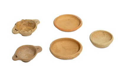 Lot 71 - A GROUP OF FIVE MINIATURE TERRACOTTA VOTIVE...