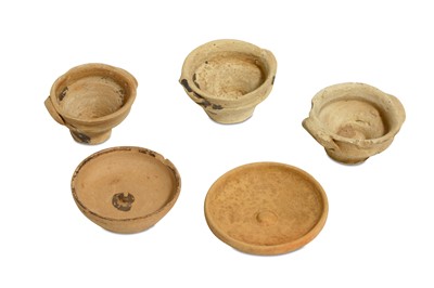Lot 72 - A GROUP OF FIVE MINIATURE TERRACOTTA VOTIVE...
