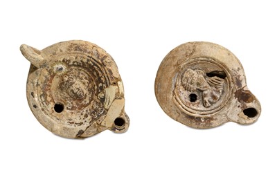 Lot 86 - TWO ROMAN TERRACOTTA OIL LAMPS Circa 2nd - 4th...