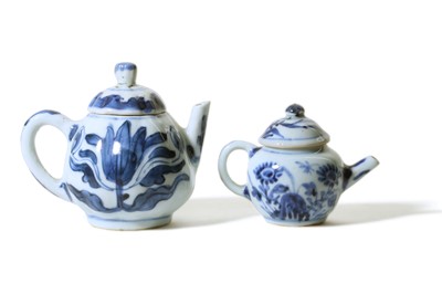 Lot 350 - TWO CHINESE BLUE AND WHITE TEAPOTS AND COVERS....