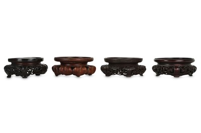 Lot 245 - FOUR CHINESE CIRCULAR WOOD STANDS. Qing...