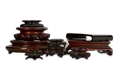 Lot 225 - NINE CHINESE WOOD STANDS.  19th / 20th Century....