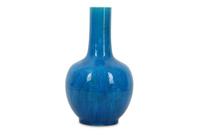 Lot 515 - A CHINESE TURQUOISE-GLAZED 'LOTUS' BOTTLE VASE....