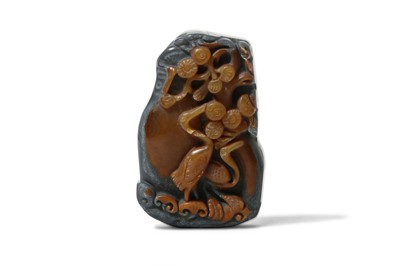 Lot 427 - A CHINESE AGATE 'CRANES AND PINES' PENDANT....