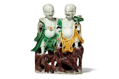 Lot 393 - A CHINESE SANCAI FIGURE OF 'HEHE TWINS'. Qing...