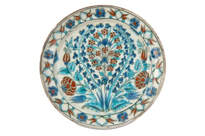 Lot 185 - AN IZNIK-STYLE POTTERY DISH Delft, Netherlands,...