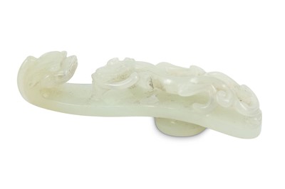 Lot 139 - A CHINESE WHITE JADE 'DRAGON' BELT HOOK. Qing...