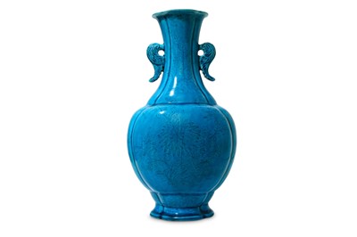 Lot 522 - A CHINESE MOULDED TURQUOISE-GLAZED...