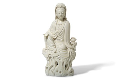 Lot 72 - A CHINESE BLANC-DE-CHINE FIGURE OF GUANYIN....