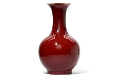 Lot 516 - A CHINESE SANGUE DE BOEUF- GLAZED BOTTLE VASE....