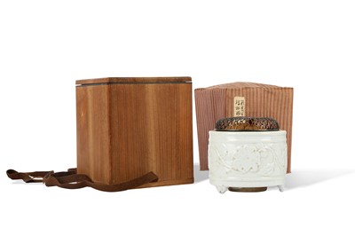 Lot 87 - A WHITE-GLAZED 'HIBISCUS' TRIPOD INCENSE...
