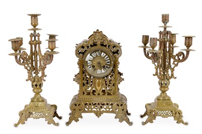Lot 682 - A French brass clock garniture, with striking...