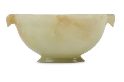 Lot 450 - A CHINESE PALE CELADON JADE TWIN HANDLED CUP....