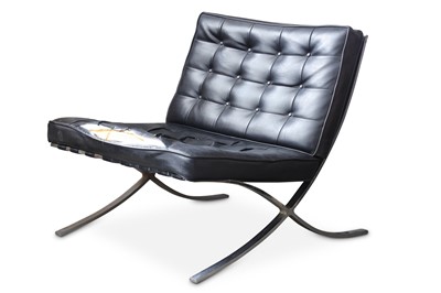 Lot 701 - A pair of 'Barcelona' chairs and a matching...