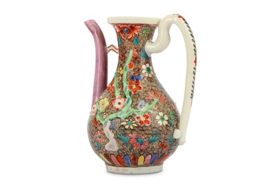 Lot 348 - A CHINESE ENAMELLED DEHUA 'BLOSSOMS' WINE POT....