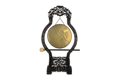 Lot 278 - A CHINESE GONG. Qing Dynasty. On a wood stand...