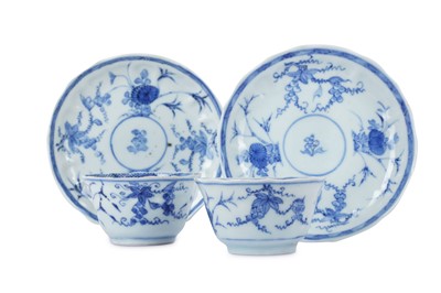 Lot 62 - A PAIR OF CHINESE BLUE AND WHITE MOULDED CUPS...