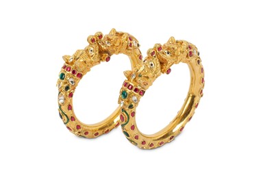 Lot 586 - TWO GOLDEN MAKARA BANGLES  Northern India,...