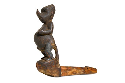 Lot 852 - A BURMESE CARVED WOOD ZOOMORPHIC POST With a...