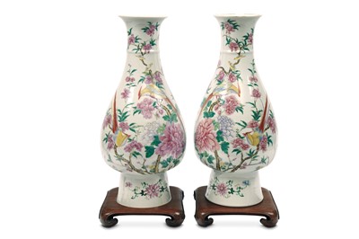 Lot 549 - A PAIR OF FAMILLE ROSE VASES. Late Qing...