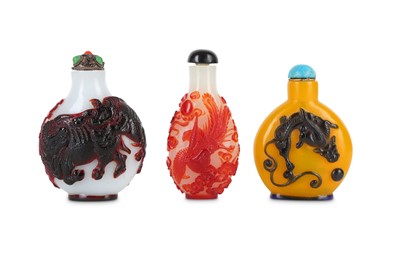 Lot 263 - THREE CHINESE OVERLAY GLASS SNUFF BOTTLES.