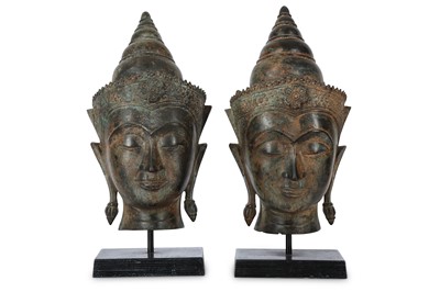 Lot 130 - A PAIR OF BRONZE HEADS OF BUDDHA. Thailand,...