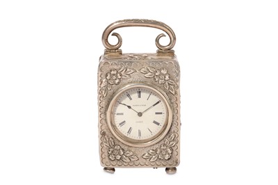 Lot 79 - AN EARLY 20TH CENTURY SILVER TRAVELLING CLOCK...