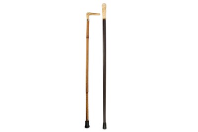 Lot 1037 - A Continental walking stick, the bone handle...