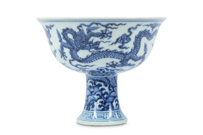 Lot 733 - A CHINESE BLUE AND WHITE ‘DRAGON’ STEM BOWL.