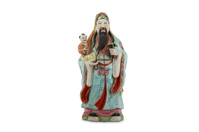 Lot 128 - A CHINESE FAMILLE ROSE FIGURE OF AN IMMORTAL...