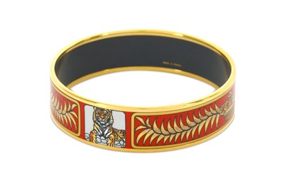 Lot 369 - Hermes Enamel Bangle, red and gold tiger...