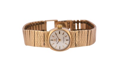 Lot 92 - OMEGA. A LADIES 9K GOLD AUTOMATIC BRACELET...