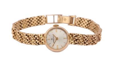 Lot 93 - HAMILTON. A LADIES 9K GOLD MANUAL BRACELET...