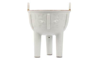 Lot 211 - A CHINESE WHITE-GLAZED ‘TAOTIE MASK’ INCENSE...