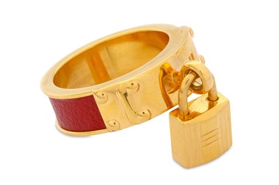 Lot 368 - Hermes Kelly Scarf Ring, gold plated with red...