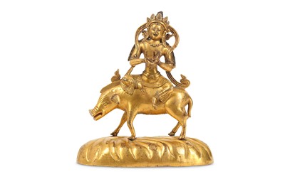 Lot 321 - A TIBETAN GILT-BRONZE FIGURE OF MARICI SEATED...