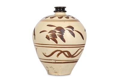 Lot 244 - A CHINESE CIZHOU VASE. Yuan Dynasty. The squat...