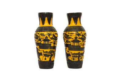 Lot 108 - A PAIR OF CHINESE BLUE OVERLAY YELLOW-GROUND BEIJING GLASS VASES