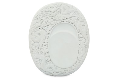Lot 342 - A CHINESE WHITE BISCUIT 'DRAGON' INKSTONE.