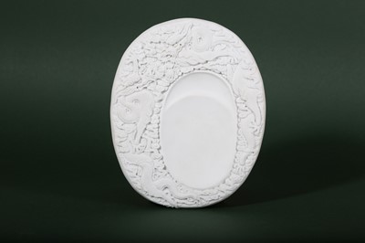 Lot 6 - A CHINESE WHITE BISCUIT 'DRAGON' INKSTONE.