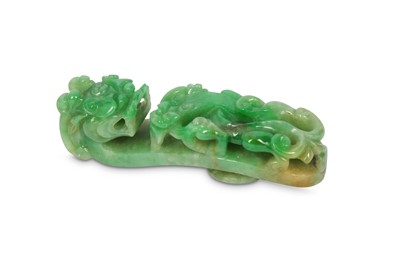 Lot 138 - A CHINESE APPLE-GREEN JADEITE BELT HOOK. Late...