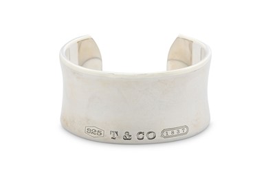 Lot 378 - A silver 'Tiffany 1837' bangle, by Tiffany &...