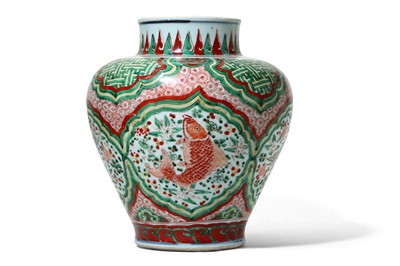 Lot 255 - A CHINESE WUCAI 'FISH' JAR.  Transitional...