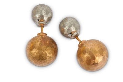 Lot 334 - A pair of bi-coloured earstuds, double-sided,...